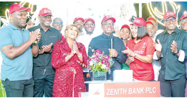 The group managing director/CEO of Zenith Bank Plc, Dr. Ebenezer Onyeagwu (4th Left) flanked by the wife of the Founder and Chairman of Zenith Bank Plc, Mrs. Kay Ovia (3rd Left); executive Director, Mr. Henry Oroh (1st Left); executive director, Dr. Temitope Fasoranti (2nd Left); executive director, Mrs Adobi Nwapa (2nd Right); and executive director, Mr. Akin Ogunranti (1st Right) at the 2023 Zenith Bank Christmas Light-Up of Ajose Adeogun Street, Victoria Island, Lagos at the weekend.