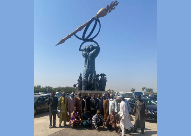 The protesting retired Police officers at the National Assembly complex on Monday.