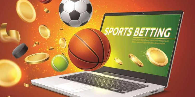 Laptop with words related to sports betting on screen.