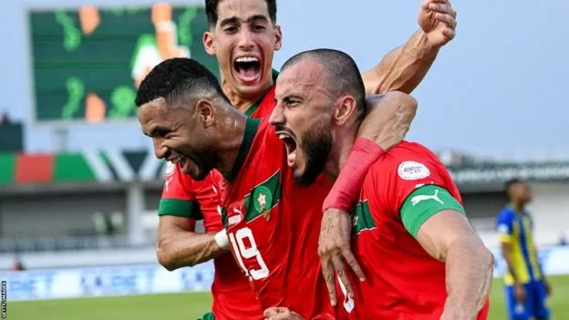 AFCON: Morocco Cruise To Winning Start, Thrash Tanzania 3-0 1 132354507 moroccocelebrateromainsaissgoalvstanzaniaedit jpg 1