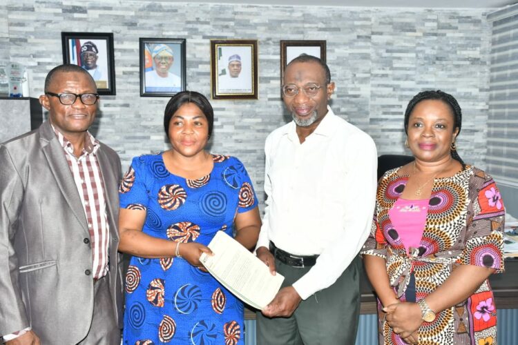 r-l: Rector, Yaba College of Technology, Dr. Engr. Ibraheem Abdul presenting letter of N34m TETFund NRF Award to the principal investigator, Mrs. Oluwatosin Amolegbe, a lecturer in Biological Department, Yabatech and flanked by Dr. Funmilayo Doherty (left), Director, Centre for Research Support and Grant Management and Dean, School of Science, Dr. Waidi Abiodun Ashiru