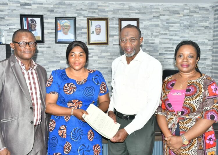 r-l: Rector, Yaba College of Technology, Dr. Engr. Ibraheem Abdul presenting letter of N34m TETFund NRF Award to the principal investigator, Mrs. Oluwatosin Amolegbe, a lecturer in Biological Department, Yabatech and flanked by Dr. Funmilayo Doherty (left), Director, Centre for Research Support and Grant Management and Dean, School of Science, Dr. Waidi Abiodun Ashiru