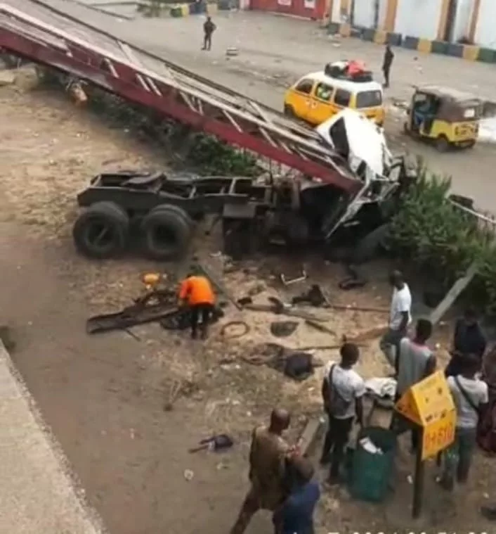 Driver, Assistant Injured As Truck Falls Off Lagos Bridge