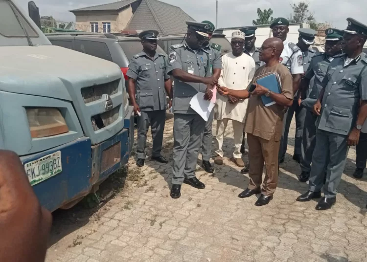 Controller for Ogun II Area Command, Comptroller Bisi Alade, handing over the bullion van's key to the representative of the bank, Mr. Benedict Okondu.