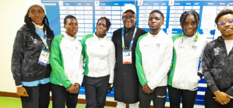 Sports minister John Owan Enoh (middle) with six Nigerian athletes to the ongoing Winter Youth Olympics in Gangeung, South Korea. Photo by Sports Ministry