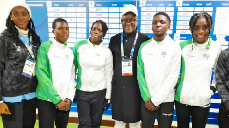 Sports minister John Owan Enoh (middle) with six Nigerian athletes to the ongoing Winter Youth Olympics in Gangeung, South Korea. Photo by Sports Ministry