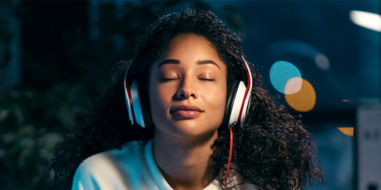 Why Listening To Music Can Heal Your Soul From Depression 1 african woman listening to music with earphones