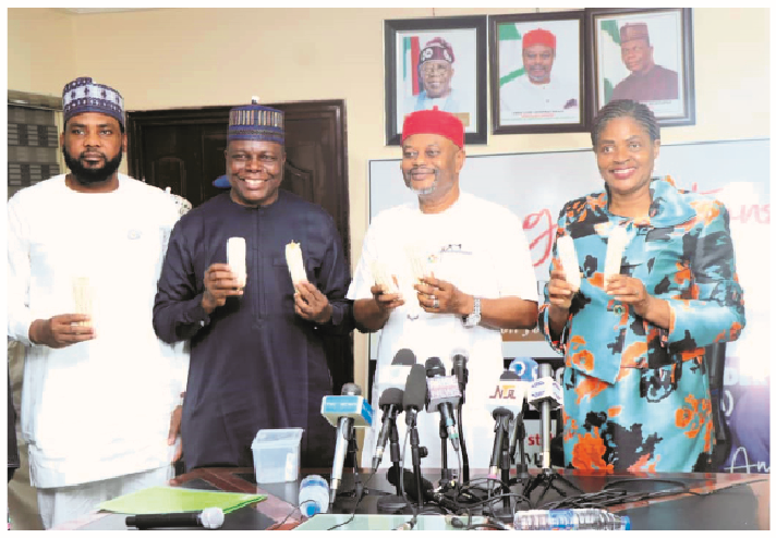 Biotechnology: Enhancing Nigeria’s Global Competitiveness With Insect-Resistant Maize 1 Minister of Innovation Science and Technology, Uche Nnaji; director-general of NABDA, Prof Abdullahi Mustapha and others displaying the insect- resistant maize