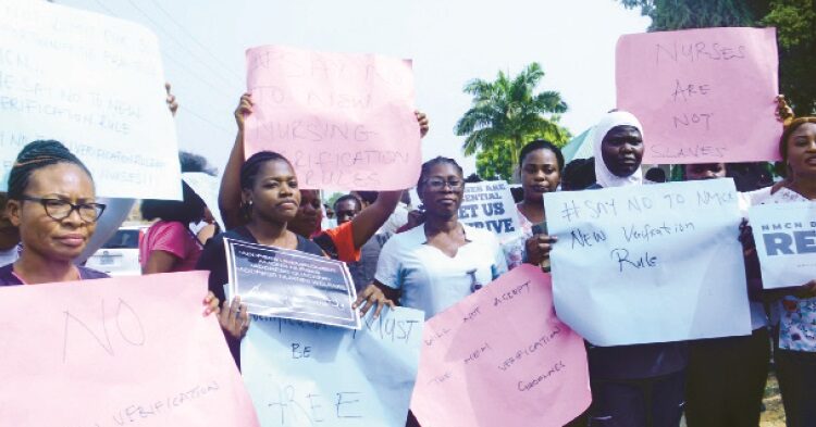 National Association of Nigeria Nurses and Midwives (NANNW), Abuja chapter, protesting against the new verification guidelines, in Abuja yesterday. PHOTO BY IBRAHIM MOHAMMED