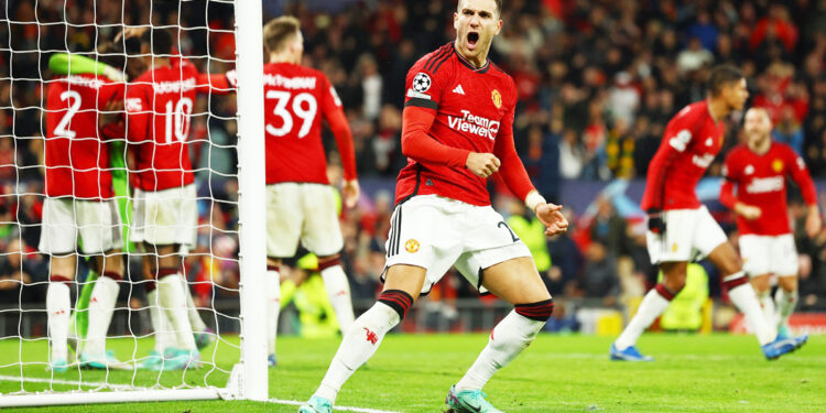 Soccer Football - Champions League - Group A - Manchester United v FC Copenhagen - Old Trafford, Manchester, Britain - October 24, 2023 Manchester United's Diogo Dalot celebrates after Andre Onana saved a penalty missed by FC Copenhagen's Jordan Larsson REUTERS/Molly Darlington