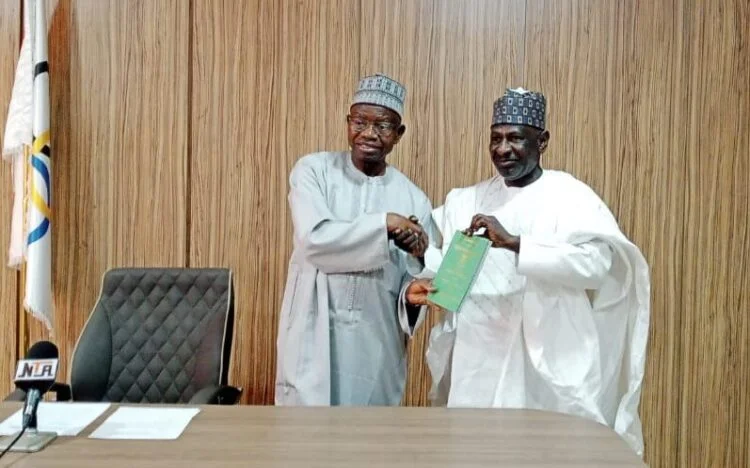 Garun-Gabbas Heads 6-man NOC Constitution Review C'ttee 1 NOC President Habu Gumel with the Chairman of the Constitution Review Committee Hussaini Garun Gabbas receiving the NOC constitution e1707509973756