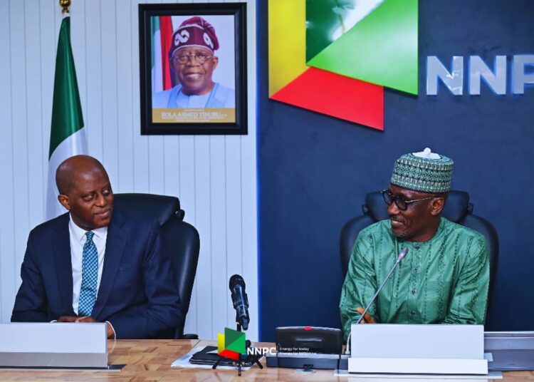 Yemi Cardoso, CBN Governor (left), Mele Kyari, Group Chief Executive Officer NNPC (right)