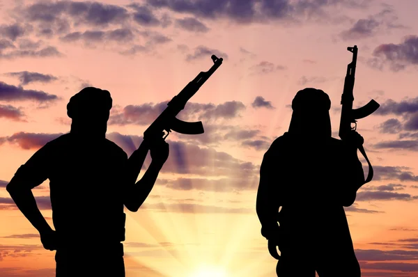 depositphotos 93662274 stock photo silhouette of two terrorists