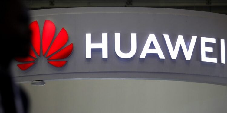 An illuminated logo above the Huawei Technologies Co. stand at the Enlit energy conference in Cape Town, South Africa, on Tuesday, May 16, 2023. Africas most industrialized economy has been dogged by rotating blackouts since 2008. Photographer: Dwayne Senior/Bloomberg