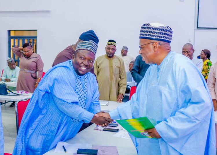 Executive secretary of the Universal Basic Education Board, Dr Hamid Bobboyi (right), congratulating the chairman of Kwara SUBEB, Prof. Shehu Adaramaja (left), on his emergence as the Dean of the Forum of State SUBEB Chairmen in Nigeria. Credit: Abdullahi Olesin