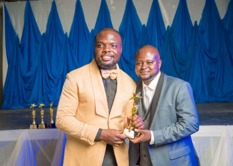 Joseph Ikyobo (left) being presented with the 2024 MACOSA Leadership Award at the Benue State University.