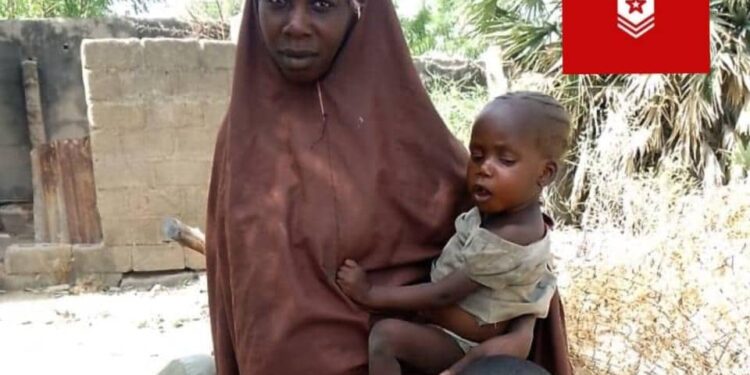 Rescued Lydia Simon with her three children. Credit: Zagazola Makama