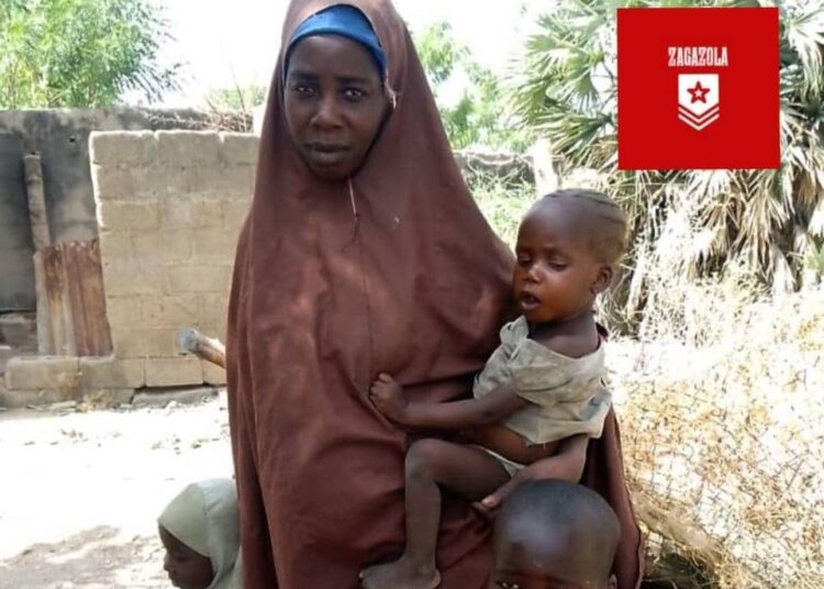 Rescued Lydia Simon with her three children. Credit: Zagazola Makama