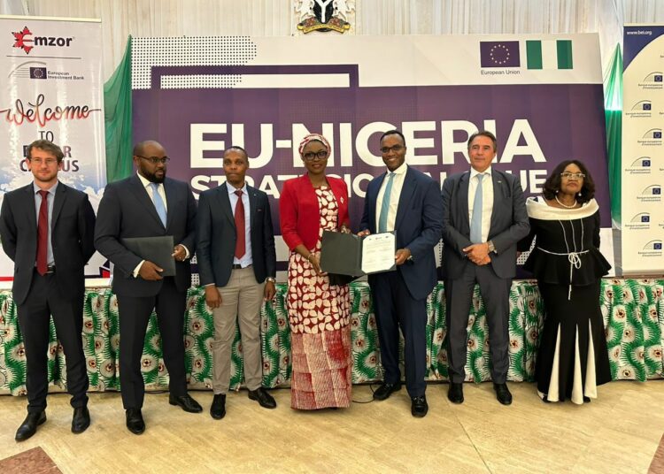 L-R: Arthur Delor, Investment Officer Project Finance Division, EIB; Moussa Nakoulima, Loan Officer, Public Service, EIB; MR Frankline Keter, CEO, APIFA; DR Jamila Bio Ibrahim, Honorable Minister of Youth; MR Emeka Okoli, Chairman of Emzor Pharmaceuticals; MR Diederick Zambon, Director for International Partners, EIB Global and Dr Stella C. Okoli, OON, Group Managing Director, Emzor Pharmaceutical Industries Ltd, at the official signing of a financing agreement for the Active Pharmaceutical Ingredient Plant, between Emzor and EIB,  which held at the Presidential Villa