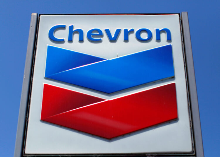 FILE PHOTO: A Chevron gas station sign is seen in Del Mar, California, April 25, 2013. Chevron will report earnings on April 26. REUTERS/Mike Blake/File Photo/File Photo