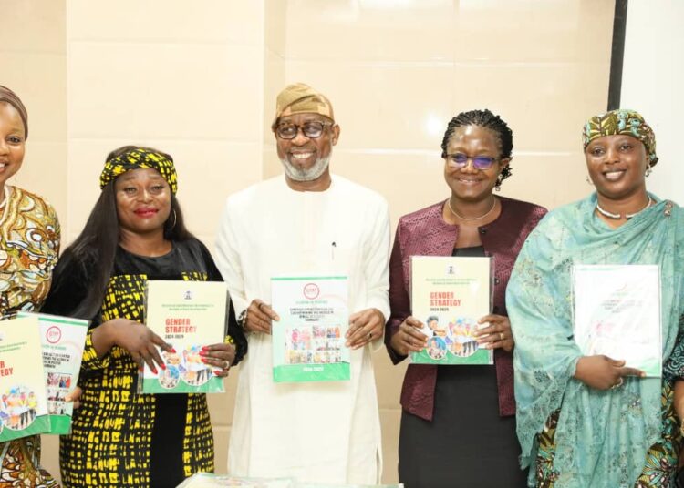 L-R: Representative of the National President of Women In Mining In Nigeria WIMIN, Mrs Emily Ofodile( Social Secretary); N&G Consultant; Hon Minister for Solid Minerals Development Dr Dele Alake; Permanent Secretary, Dr Mary Ogbe & WIMIN Executive; during the Unveiling of the Gender Strategy by the Hon. Minister