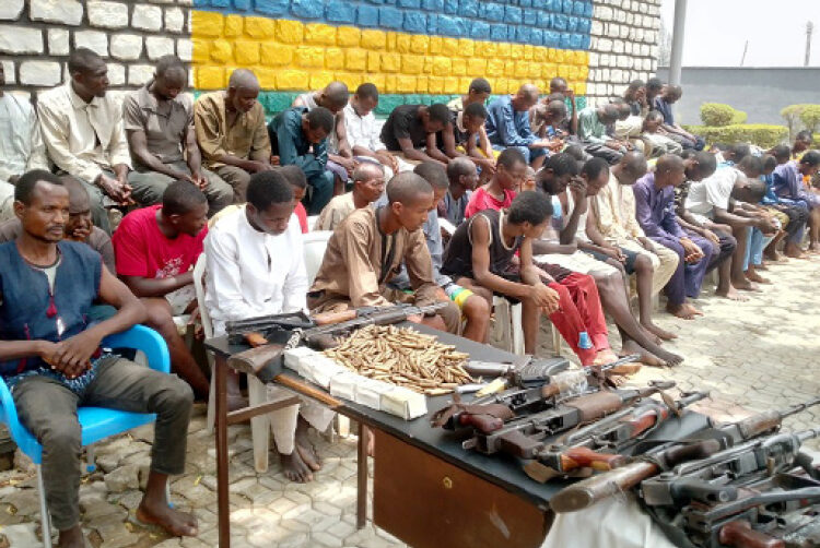 A cross section of suspected kidnappers, bandits and armed robbers, including the suspected mastermind of the March 28, 2022 Abuja-Kaduna train attack being paraded at the Kaduna State Police Command in Kaduna, yesterday PHOTO BY IBRAHIM MOHAMMED