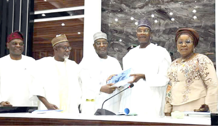 Minister of Education, Tahir Mamman (2nd right) receiving the report of the TETFund ad hoc committee on operationalisation of skills development special intervention from a member of the committee, Engr. Dr. Muhammad Nuru, flanked by the minister of State, Dr. Yusuf Sununu (2n left), permanent secretary, Mrs Didi Walson-Jack (r) and TETFund executive secretary, Arc. Sonny Echono.