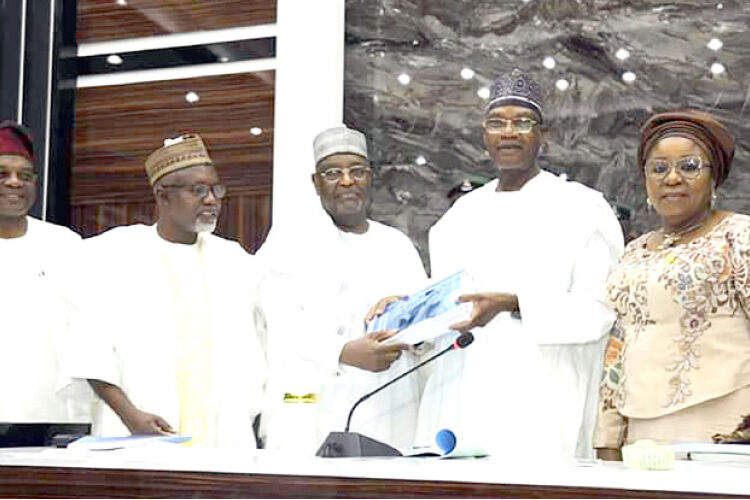 Minister of Education, Tahir Mamman (2nd right) receiving the report of the TETFund ad hoc committee on operationalisation of skills development special intervention from a member of the committee, Engr. Dr. Muhammad Nuru, flanked by the minister of State, Dr. Yusuf Sununu (2n left), permanent secretary, Mrs Didi Walson-Jack (r) and TETFund executive secretary, Arc. Sonny Echono.