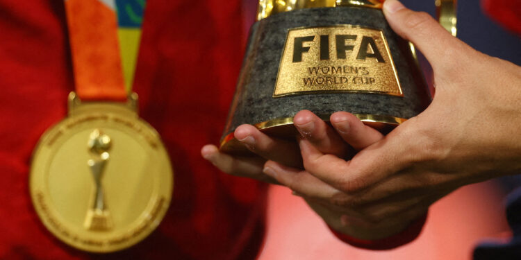 FILE PHOTO: Soccer Football - FIFA Women's World Cup Australia and New Zealand 2023 - Final - Spain v England - Stadium Australia, Sydney, Australia - August 20, 2023 General view of a Spain player holding the World Cup trophy after the match REUTERS/Carl Recine/File Photo