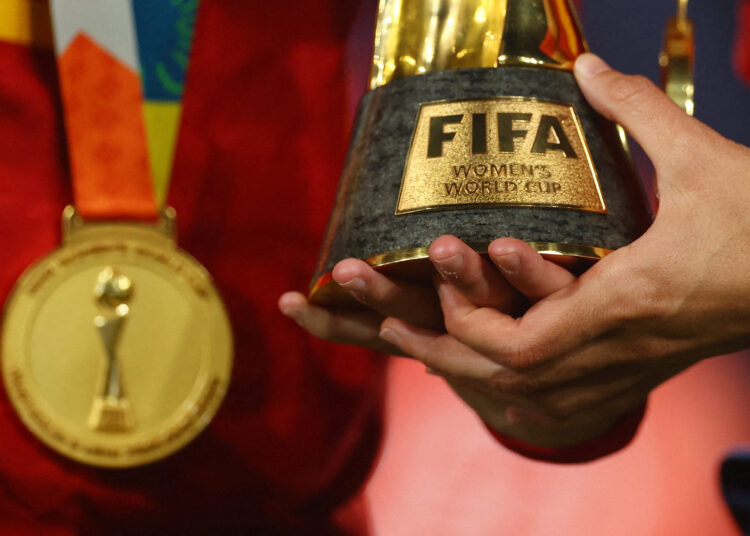 FILE PHOTO: Soccer Football - FIFA Women's World Cup Australia and New Zealand 2023 - Final - Spain v England - Stadium Australia, Sydney, Australia - August 20, 2023 General view of a Spain player holding the World Cup trophy after the match REUTERS/Carl Recine/File Photo