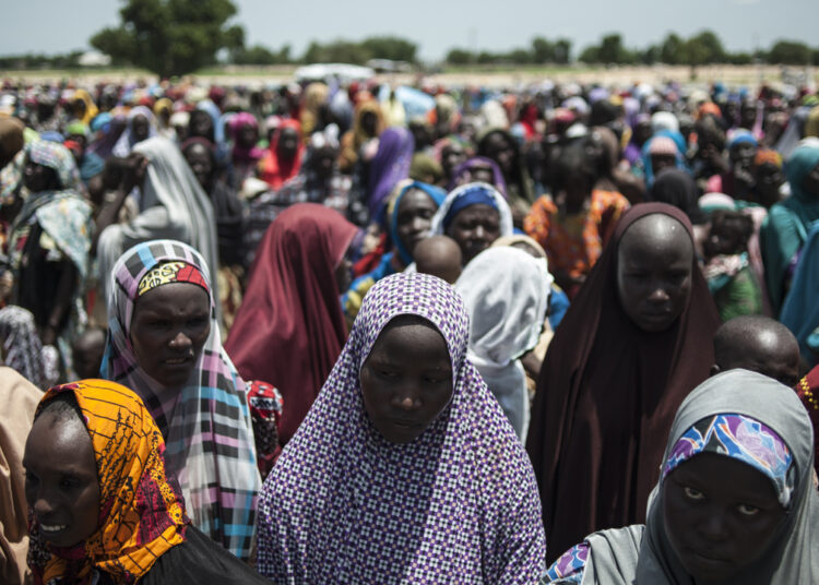 In this photo taken on September 15, 2016 women and children queue to enter one of the Unicef nutrition clinics at the Muna makeshift camp which houses more than 16,000 IDPs (internaly displaced people) on the outskirts of Maiduguri, Borno State, northeastern Nigeria.
Aid agencies have long warned about the risk of food shortages in northeast Nigeria because of the conflict, which has killed at least 20,000 since 2009 and left more than 2.6 million homeless. In July, the United Nations said nearly 250,000 children under five could suffer from severe acute malnutrition this year in Borno state alone and one in five -- some 50,000 -- could die.  / AFP PHOTO / STEFAN HEUNIS