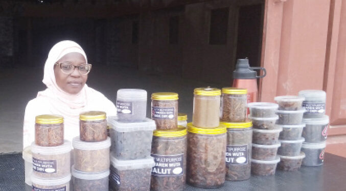 CEO of Suti-Multipurpose, Sutiya Kolo selling different perfumes at North East Trade Fair in Bauchi. (Credit: Kamal Ibrahim)