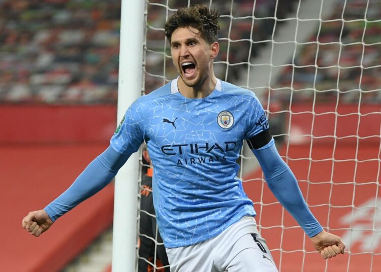 Soccer Football - Carabao Cup - Semi Final - Manchester United v Manchester City - Old Trafford, Manchester, Britain - January 6, 2021 Manchester City's John Stones celebrates scoring their first goal Pool via REUTERS/Shaun Botterill EDITORIAL USE ONLY. No use with unauthorized audio, video, data, fixture lists, club/league logos or 'live' services. Online in-match use limited to 75 images, no video emulation. No use in betting, games or single club /league/player publications.  Please contact your account representative for further details.