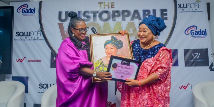 Founder of Unstoppable Women Network, Mrs Ijeoma Igbaji delivering 
Icon Award to Mrs Patricia Okerayi during the event.