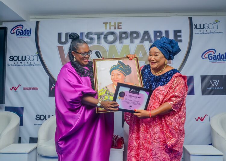 Founder of Unstoppable Women Network, Mrs Ijeoma Igbaji delivering 
Icon Award to Mrs Patricia Okerayi during the event.