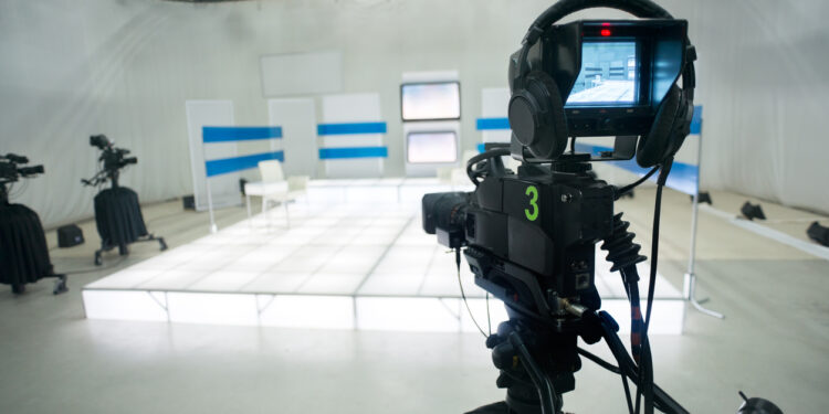 Television studio with camera and lights