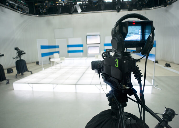 Television studio with camera and lights