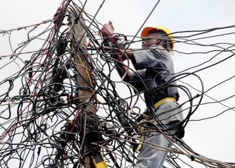 Abuja Electricity Distribution Company staff disconnecting a termina