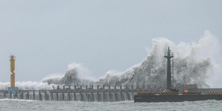 Waves break on the coastline in Yilan on July 24, 2024 as Typhoon Gaemi approaches Taiwan. (Photo by I-Hwa CHENG / AFP)