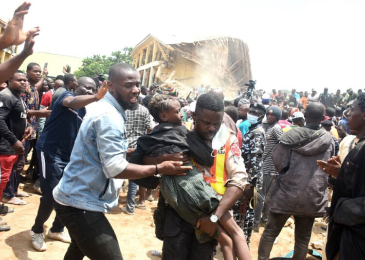 Pic.9. People rescue one of the students of the Collapsed Saint Academy School, Jos on Friday (12/7/24).

0159/JULY/12/7/2024/Sunday Adah/MO/NAN