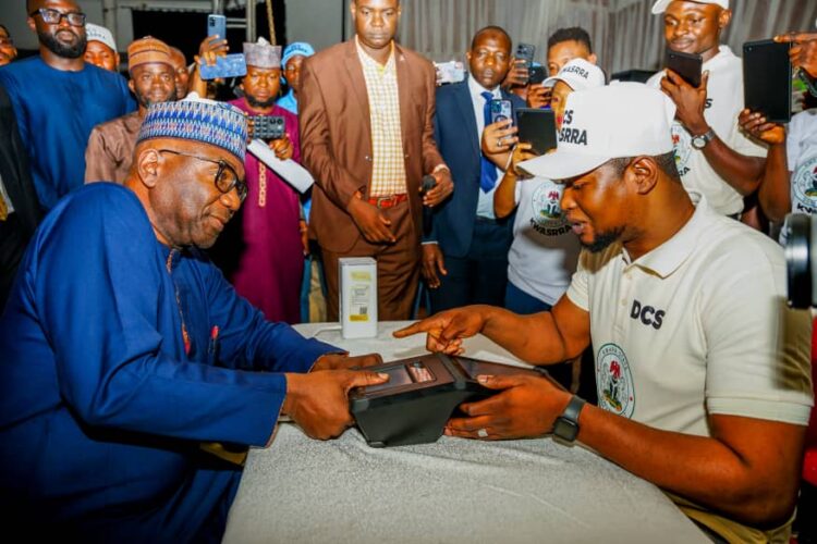 Kwara State governor, AbdulRahman AbdulRazaq (left), being captured during the official flag-off of the Kwara State Residents' Registration Exercise, in Ilorin, on Monday. Photo by Abdullahi Olesin, Ilorin.