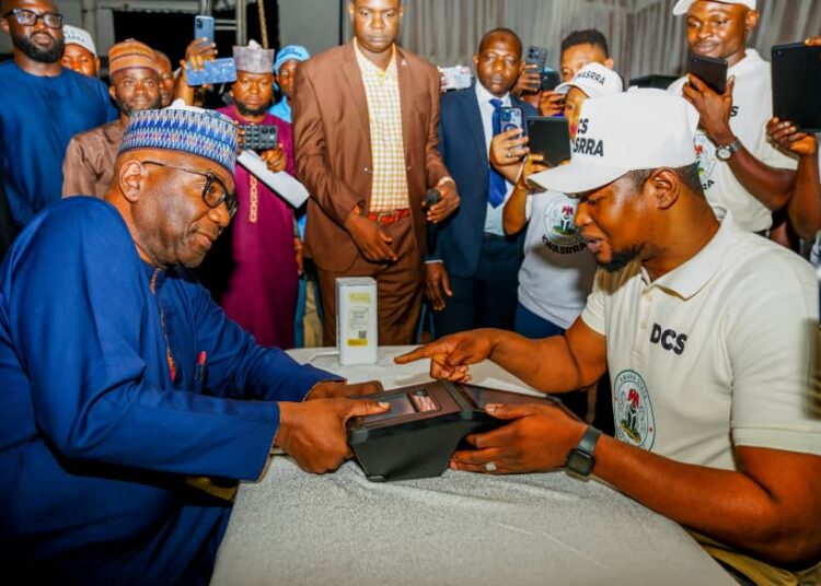 Kwara State governor, AbdulRahman AbdulRazaq (left), being captured during the official flag-off of the Kwara State Residents' Registration Exercise, in Ilorin, on Monday. Photo by Abdullahi Olesin, Ilorin.