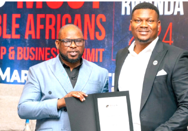 R-L: Managing director/CEO  Adozillion Homes and Realty, Dr. Simon Adozi receiving the Emerging Africa Real Estate Investment Management Company of the Year Award from project director Africa 100 most notable peace icon, Kingsley Amafibe during the 100 Most Notable African Leadership and Business Summit in Kigali, Rwanda, yesterday.
