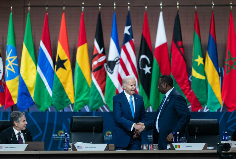 President Joe Biden, center, greets President Macky Sall of Senegal as Secretary of State Antony Blinken looks on at the U.S.-Africa Leaders Summit at the Walter E. Washington Convention Center in Washington on Thursday, Dec. 15, 2022. (Cheriss May/The New York Times)