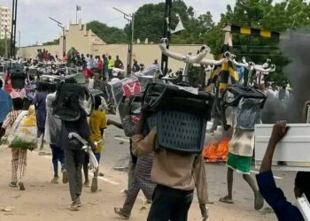 PICTORIAL: Hoodlums Loot Multi-million Naira Items From NCC Industrial Park In Kano