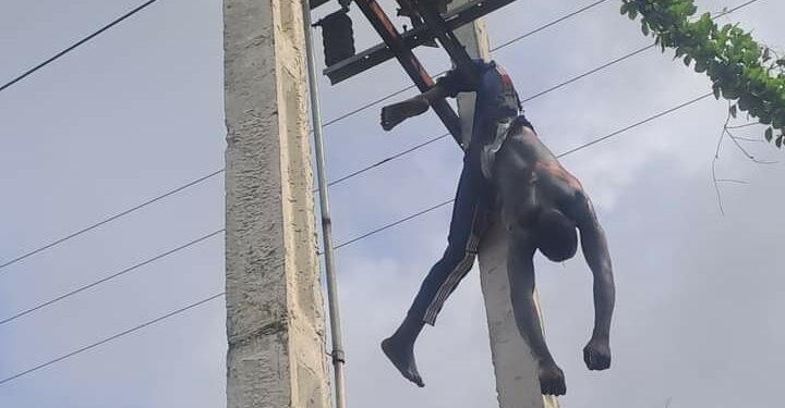 Cable Thieves Trapped To High Tension Pole In Akwa Ibom