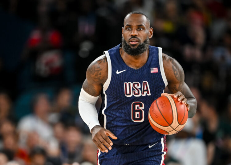 LeBron James of USA controls the Ball during the Men's Basketball Quarterfinal match between Brazil and United State on Day 11 of the Olympic Games Paris 2024 at Bercy Arena on August 6, 2024 in Paris, France. (Photo by Harry Langer/DeFodi Images via Getty Images)