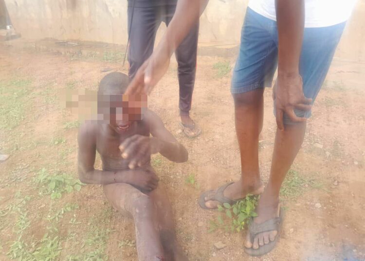 One of the suspected thieves that set the building ablaze in Ilorin, Kwara State, on Wednesday. Photo by Abdullahi Olesin.