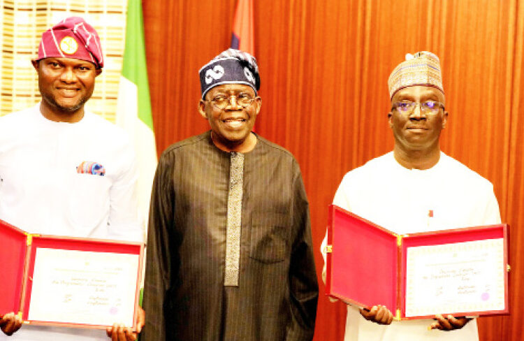 L-R: Edo State deputy, governor-elect Dennis Idahosa; President Bola Ahmed Tinubu; Edo State governor-elect, Monday Okpebholo officially presented their certificates of return to the President at the Presidential Villa Abuja, yesterday.  PHOTO BY REMI AKUNLEYAN