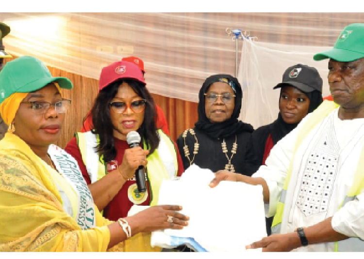 Deputy Governor,  Manassah Daniel Jatau ( R), Commissioner of Women Affairs,  Asma'u Iganus ( L) and other officials during the launching of the distribution of treated mosquito nets in Gombe